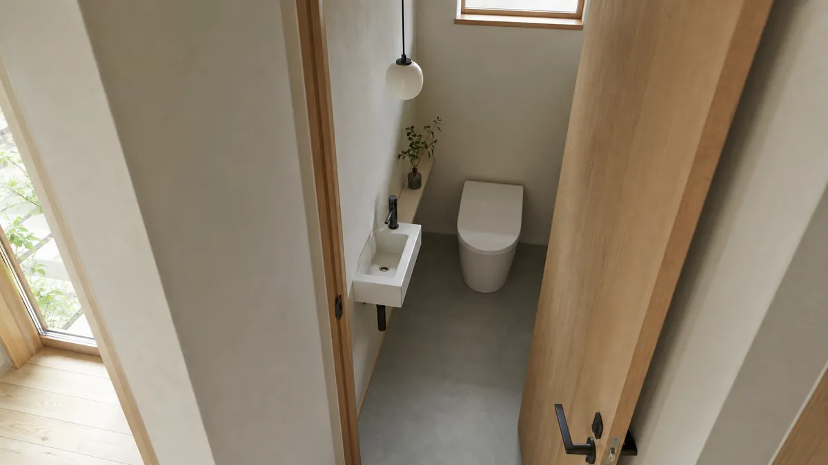 扉の開閉と便器まわりの動線を確かめるトイレ照明の配置